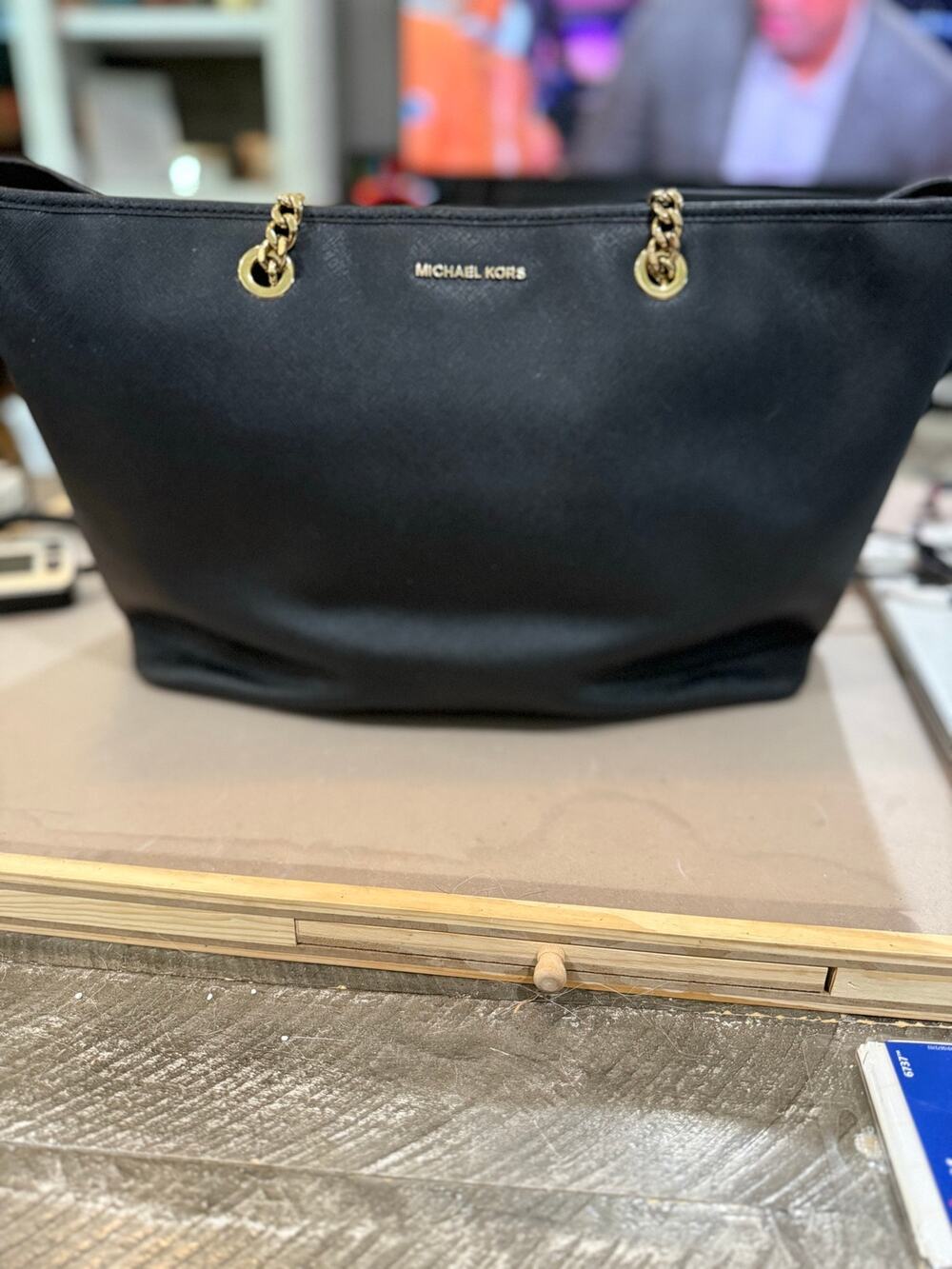 106. Michael Kors black saffiano Jet Set Tote